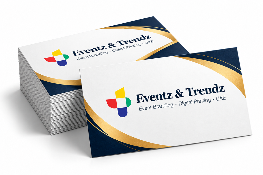 Branded business cards with navy blue and gold design for professional printing in UAE
